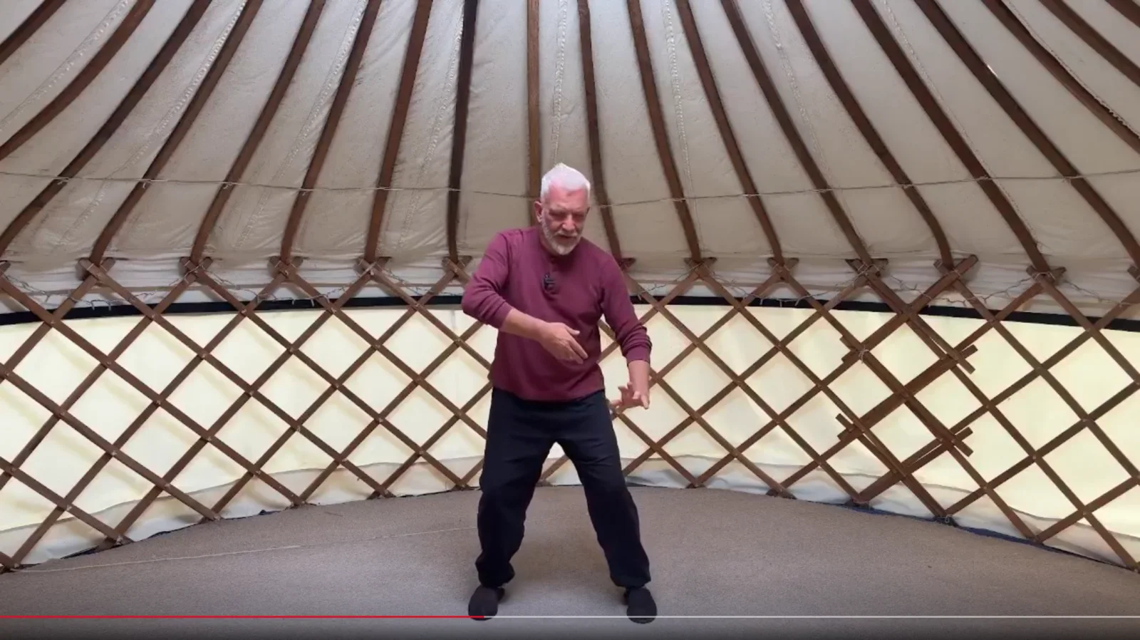 John Millar practising one of the four movements in the yurt