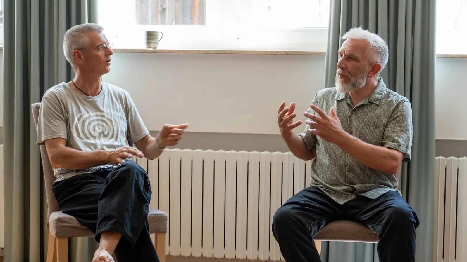 John Millar in conversation with a fellow practitioner